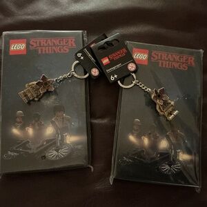 LOT OF LEGO STRANGER THINGS VHS NOTEBOOKS AND KEYCHAINS